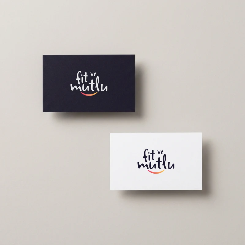Fit ve Mutlu logo on dark and white business cards