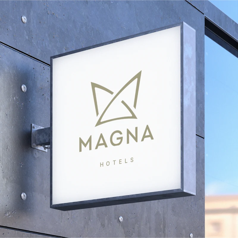 Duvara monte ışıklı Magna Hotels tabelası